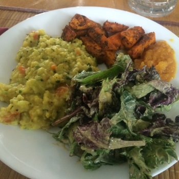 This lunch at Ayurveda Health Center, Alachua, Florida, looks like any healthy plant-based meal, but there's meaning behind it. It's a substantial meal, ideal for midday; the dal is spiced to calm flighty Vata dosha, the tempeh and mashed sweet potatoes to pacify irritable Pitta, and the salad to lighten and energize slow-moving Kapha.